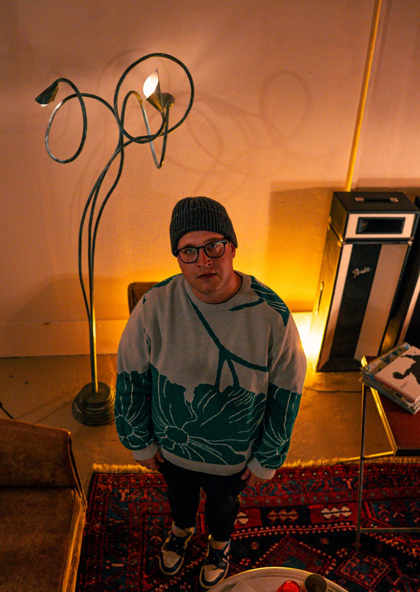 Naulé seen from above beside a curling floor lamp